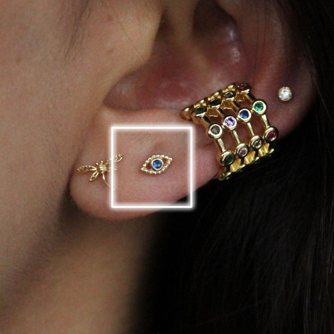 BROQUEL ORO 10K OJO FARA